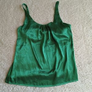 Green and white polka dot blouse